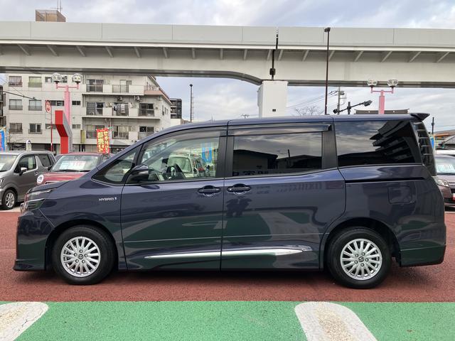 ヴォクシーハイブリッドV 9インチナビ バックカメラ ETC フルセグ保証1年間・距離無制限付き 後席モニター リヤオートエアコン シートヒーター Bluetoothオーディオ DVD再生 CD再生 7人乗りクルーズコントロール スマートキー 電動格納ミラー(東京都)の中古車