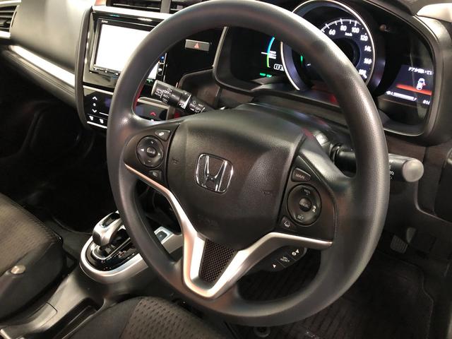 フィットハイブリッドＦ　走行１６６７４キロ／ナビ／バックカメラ／ＥＴＣ一年保証・走行距離無制限　走行１６６７４キロ　ワンセグナビ　ブルートゥース　バックカメラ　オートライト　ＬＥＤヘッドライト　ＥＴＣ（埼玉県）の中古車