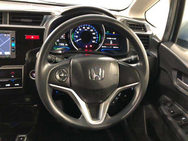 フィットハイブリッドFパッケージ 走行52471キロ/ワンセグナビ/バックカメラ1年保証距離無制限 走行距離52471キロ ワンセグナビ バックカメラ ブルートゥース 純正マット サイドエアバッグ 電動格納式ドアミラー プッシュスタート(埼玉県)の中古車