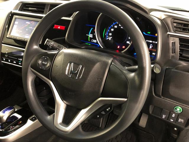 フィットハイブリッドFパッケージ 走行52471キロ/ワンセグナビ/バックカメラ1年保証距離無制限 走行距離52471キロ ワンセグナビ バックカメラ ブルートゥース 純正マット サイドエアバッグ 電動格納式ドアミラー プッシュスタート(埼玉県)の中古車