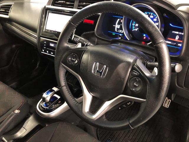 フィットハイブリッドＳパッケージ　走行７０２５２キロ／ナビ／バックカメラ一年保証・走行距離無制限走行７０２５２キロ　ワンセグナビ　ＥＴＣ　バックカメラ　ブルートゥース　オートライト　ＬＥＤヘッドライト（埼玉県）の中古車