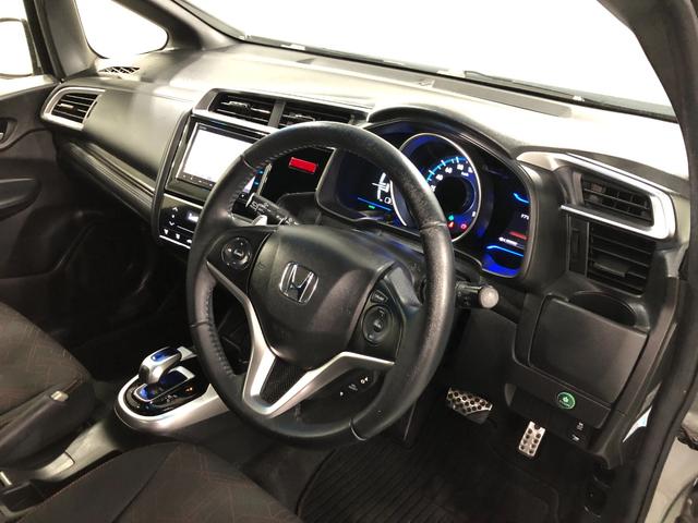 フィットハイブリッドＳパッケージ　走行７０２５２キロ／ナビ／バックカメラ一年保証・走行距離無制限走行７０２５２キロ　ワンセグナビ　ＥＴＣ　バックカメラ　ブルートゥース　オートライト　ＬＥＤヘッドライト（埼玉県）の中古車