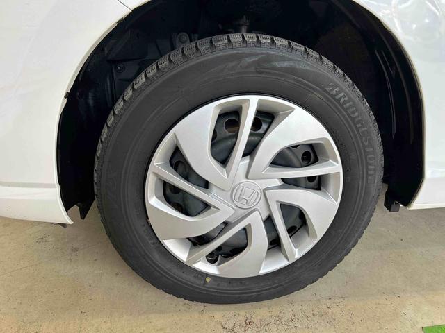 フリードＧ・ホンダセンシング４ＷＤ　オートライト／エアコン　純正ナビ　バックカメラ　ステアリングスイッチ　クルーズコントロール　ＥＣＴ　運転席・助手席シートヒータースイッチ　両側パワースライドドア　純正リモコンエンスタ（秋田県）の中古車