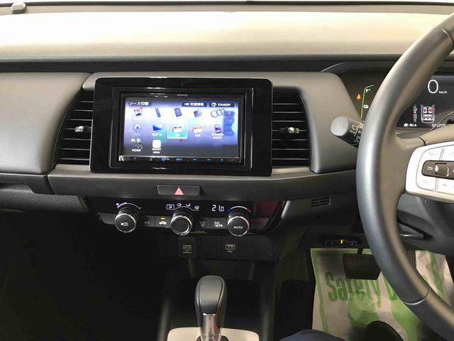 フィットｅ：ＨＥＶホーム４ＷＤ　Aftermarketナビ　バックカメラ　ＥＴＣ　オートエアコン／ライト　ＬＥＤヘッドライト　クルーズコントロール　Aftermarketドライブレコーダー　電動格納ドアミラー　サイドエアバック　チルトステアリング（秋田県）の中古車