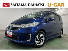 フリードハイブリッド 中古車 ジャストセレクション　走行６８６５８キロ／ナビ／後席モニター１年保証距離無制限　走行距離６８６５８キロ　ワンセグナビ　バックカメラ　後席モニター　純正マット　助手席エアバッグ　オートライト　ＨＩＤヘッドランプ　両側電動スライドドア　電動格納式ドアミラー