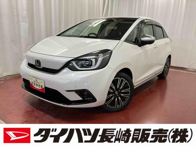 フィットe:HEVリュクス下取車 衝突被害軽減システム ナビ 前後ドラレコ アダプティブクルーズコントロール シートヒーター ETC 電子パーキング 障害物センサー SOSボタン フルセグTV(長崎県)の中古車